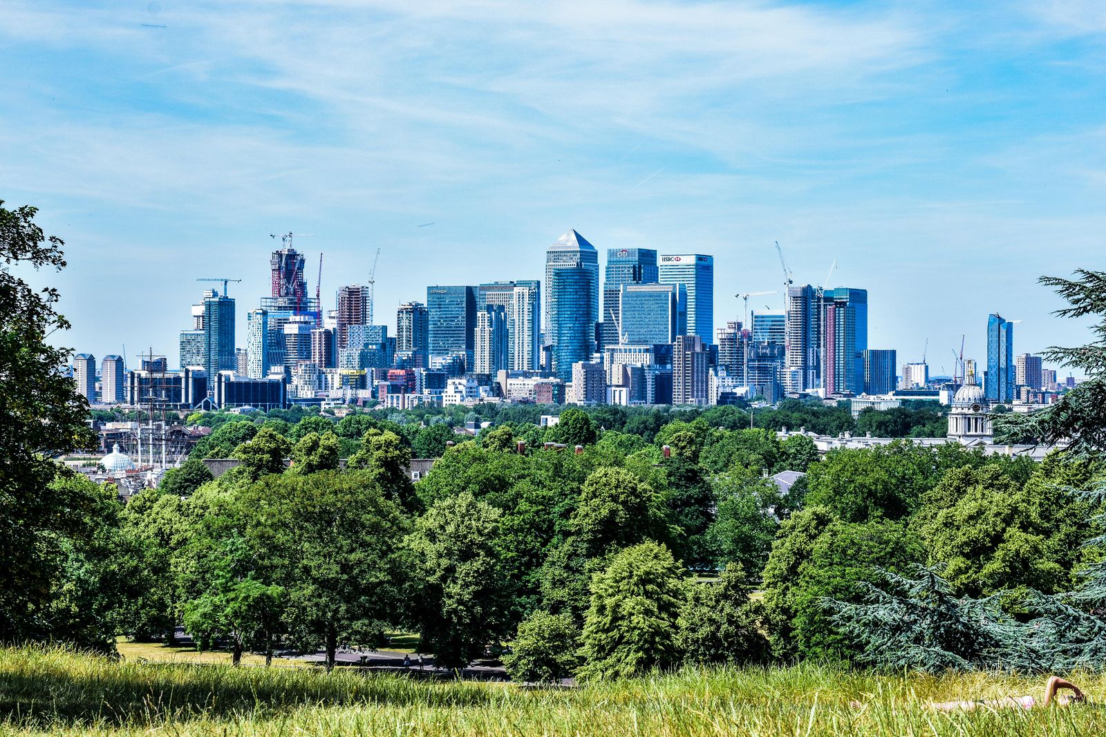 City skyline on the horizon behind open landscape